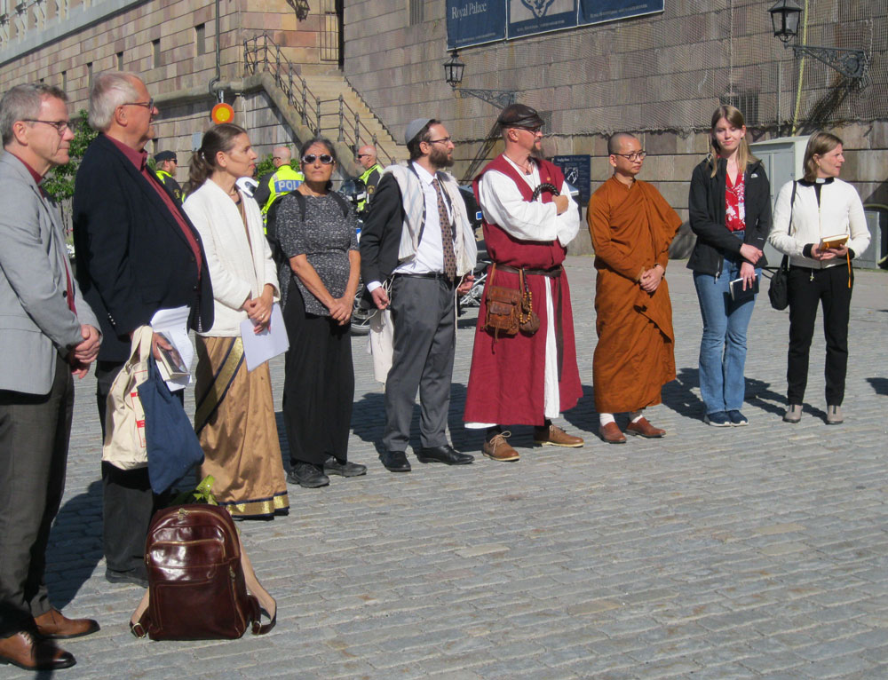 Faith representatives prepare to pray